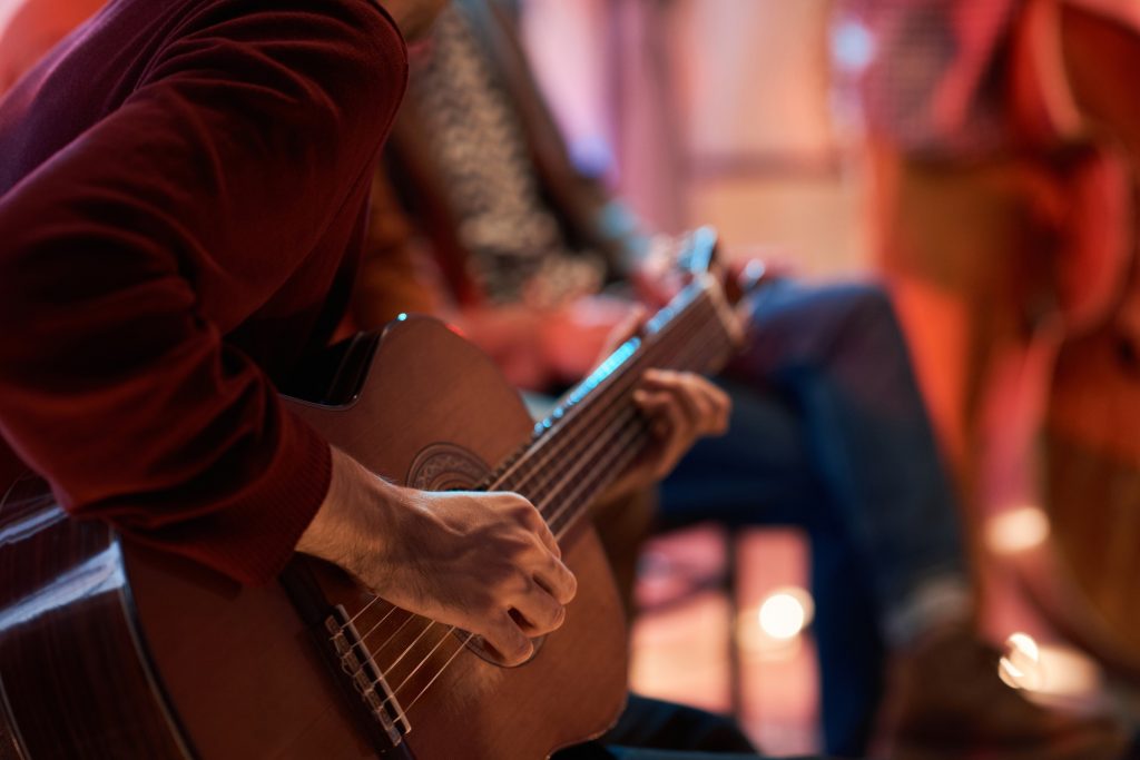 Man learning to play guitar